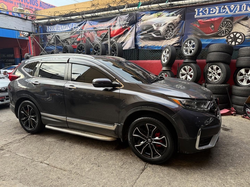 Kelvin E. Comercial Logo